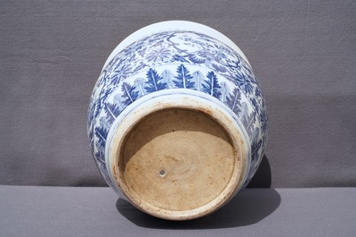 A Chinese blue and white fish bowl and a famille rose 'dragon' jardini&egrave;re, 19th C. and Yongzheng